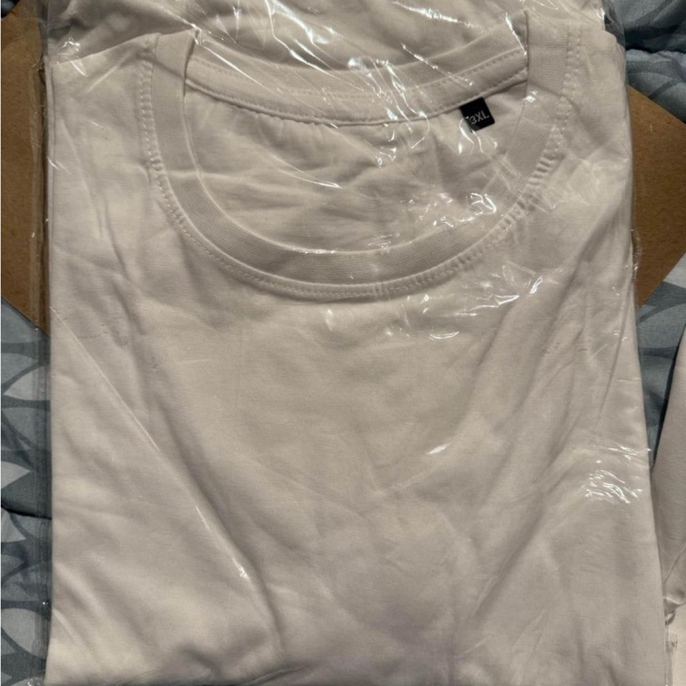 Black and white shirts in large. New. Cotton breathable fabric.